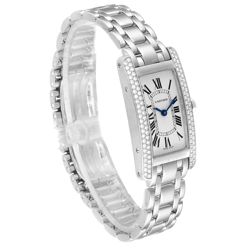 The Cartier Tank Americaine WB7018L1 Women
s White Gold Silver Dial WB7018L1 Women
s White Gold Silver Dial watch is shown at a three-quarter angle highlighting its rectangular face, metal bracelet, and diamond-studded bezel.