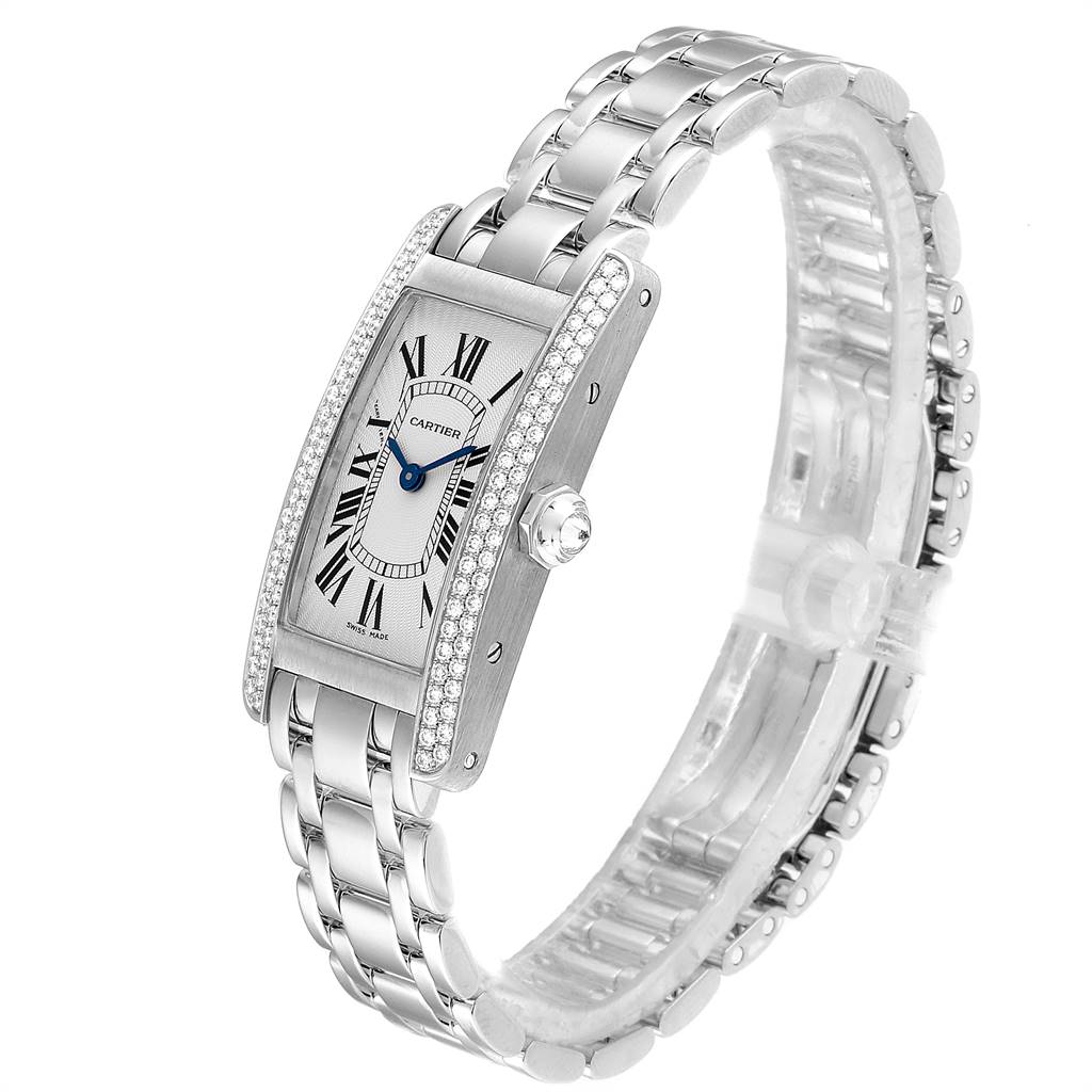 The Cartier Tank Américaine watch is shown from a side angle, displaying its rectangular face, metal strap, and diamond-studded bezel.