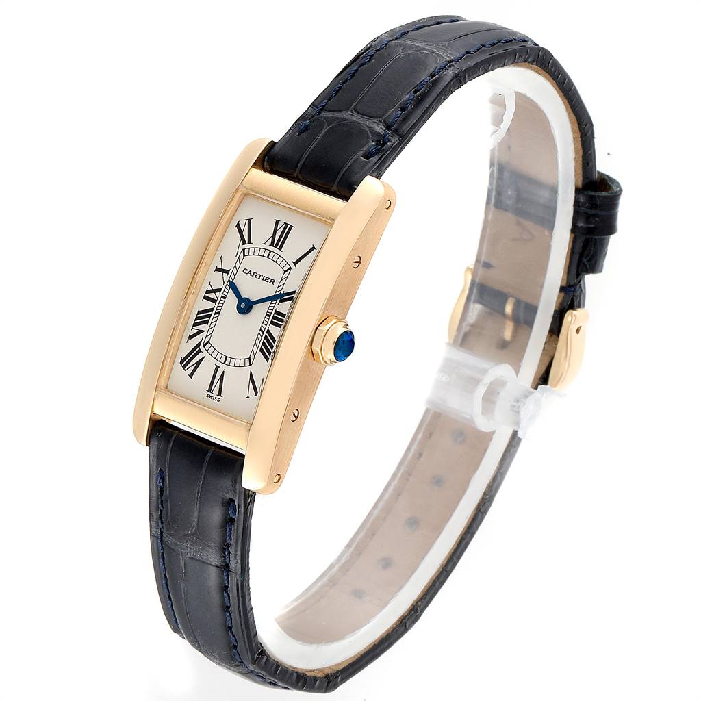 The image shows a Cartier Tank Americaine W2601556 Women's Yellow Gold Silver Dial W2601556 Women's Yellow Gold Silver Dial watch angled slightly from the side, highlighting its rectangular face and leather strap.
