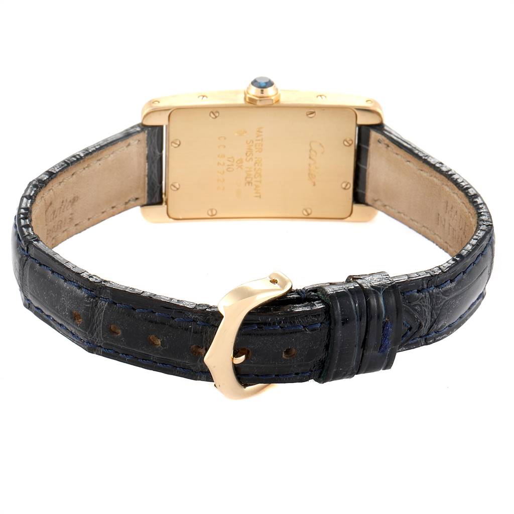 The image shows the back view and clasp of a Cartier Tank Americaine W2601556 Women's Yellow Gold Silver Dial W2601556 Women's Yellow Gold Silver Dial watch with a leather strap.