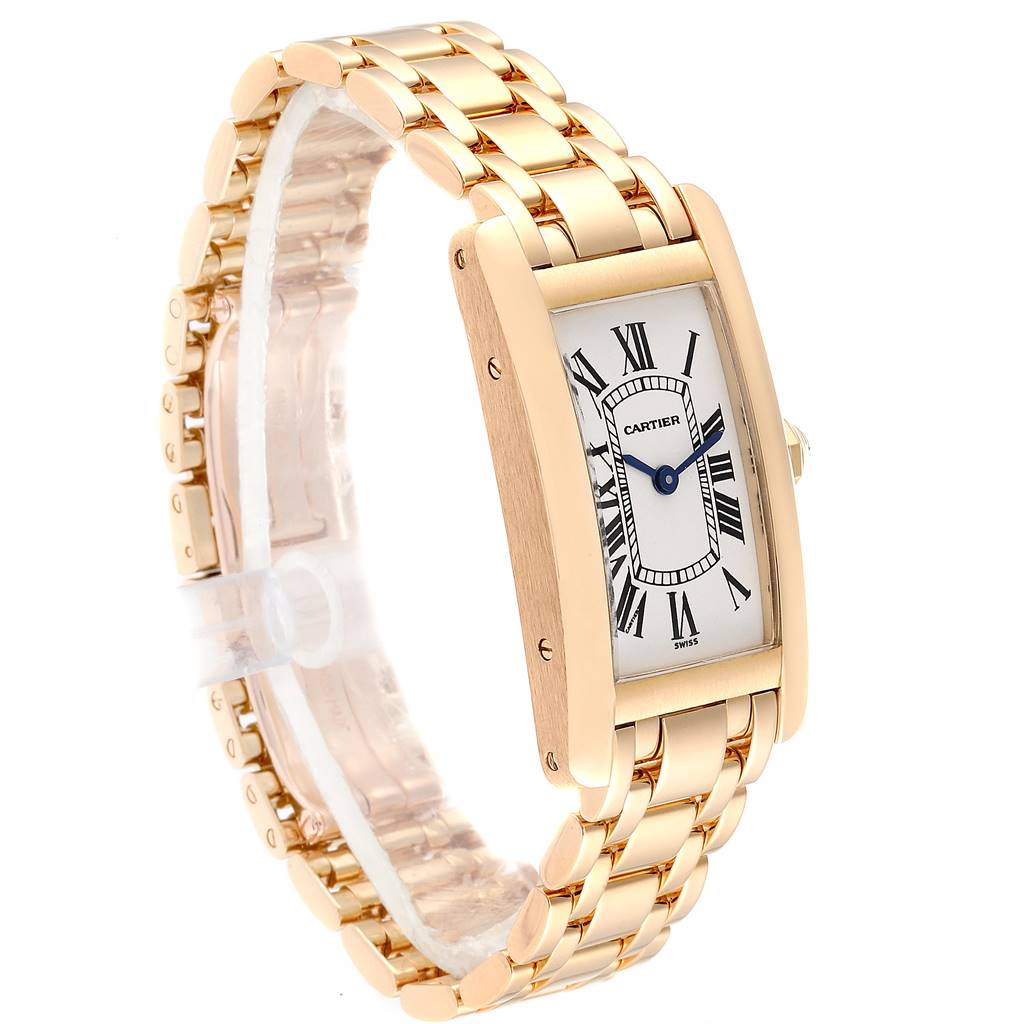 The image shows a Cartier Tank Americaine W26015K2 Women's Yellow Gold Silver Dial W26015K2 Women's Yellow Gold Silver Dial watch at an angled view, highlighting its rose gold case, bracelet, and Roman numeral dial.