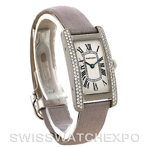 The image shows a Tank Americaine watch by Cartier in a three-quarter angle, highlighting the face, bezel, and strap.