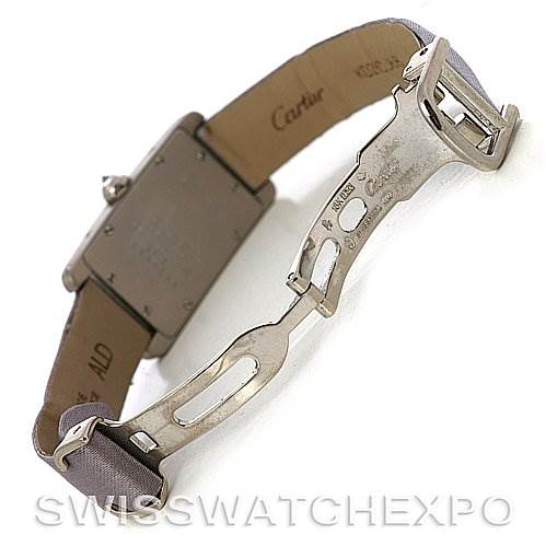 The image shows the backside and clasp of the Cartier Tank Americaine Women
s White Gold Silver Dial Women
s White Gold Silver Dial watch, with the deployment clasp open.