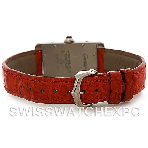 This is a rear view of a Cartier Tank Américaine watch, showcasing its red leather strap and embossed buckle.