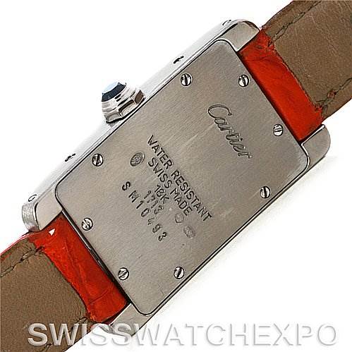 This image shows the back of a Cartier Tank Américaine watch, highlighting the caseback details and parts of the leather strap.