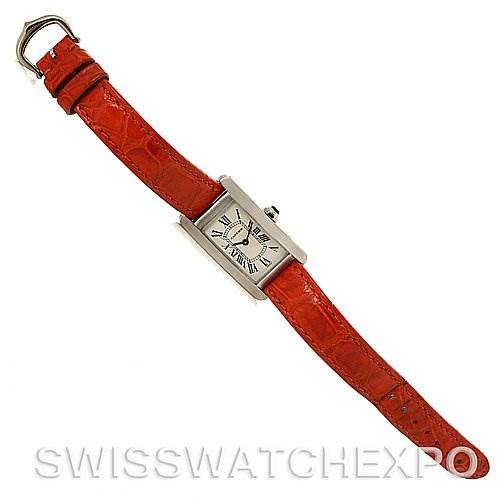This image shows a top-down view of the Cartier Tank Americaine W2601956 Women
s White Gold Silver Dial W2601956 Women
s White Gold Silver Dial watch with a red leather strap.