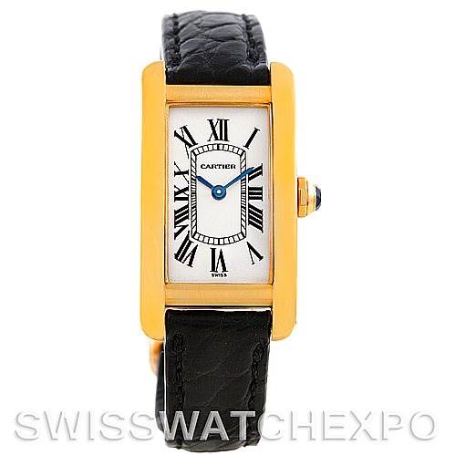 The image shows a front view of the Cartier Tank Americaine W2601956 Women's Yellow Gold Silver Dial W2601956 Women's Yellow Gold Silver Dial watch, highlighting the face, Roman numerals, and black leather strap.