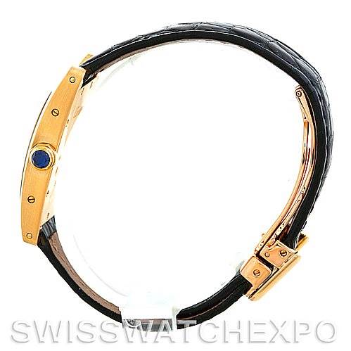 The image shows a side view of a Cartier Tank Americaine W2601956 Women's Yellow Gold Silver Dial W2601956 Women's Yellow Gold Silver Dial watch, highlighting the bezel, crown, and part of the leather strap.