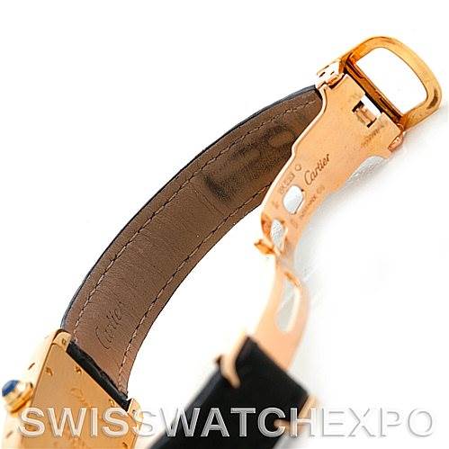 This image shows the clasp and inner leather strap of a Cartier Tank Americaine W2601956 Women's Yellow Gold Silver Dial W2601956 Women's Yellow Gold Silver Dial watch at an angle that highlights the clasp mechanism.