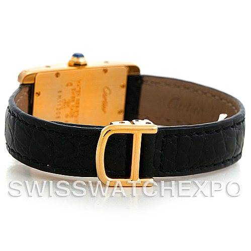 The image shows the back and side angle of a Cartier Tank Americaine W2601956 Women's Yellow Gold Silver Dial W2601956 Women's Yellow Gold Silver Dial watch, highlighting the gold buckle and leather strap.