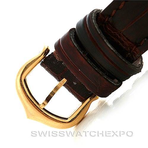 This image shows a close-up of the buckle and strap of a Cartier Tank Americaine W2601956 Women's Yellow Gold Silver Dial W2601956 Women's Yellow Gold Silver Dial watch.