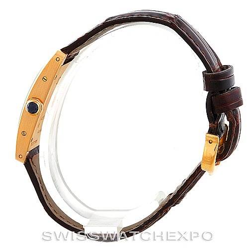 The image shows a Cartier Tank Americaine W2601956 Women's Yellow Gold Silver Dial W2601956 Women's Yellow Gold Silver Dial watch from a side angle, highlighting the case and brown leather strap.