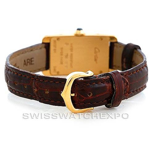 The image shows the back view of a Cartier Tank Americaine W2601956 Women's Yellow Gold Silver Dial W2601956 Women's Yellow Gold Silver Dial watch, highlighting the leather strap and gold buckle.