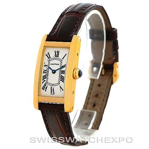 The image shows a Cartier Tank Americaine W2601956 Women's Yellow Gold Silver Dial W2601956 Women's Yellow Gold Silver Dial watch, focusing on its front and side angles, leather strap, and rectangular case with Roman numerals.