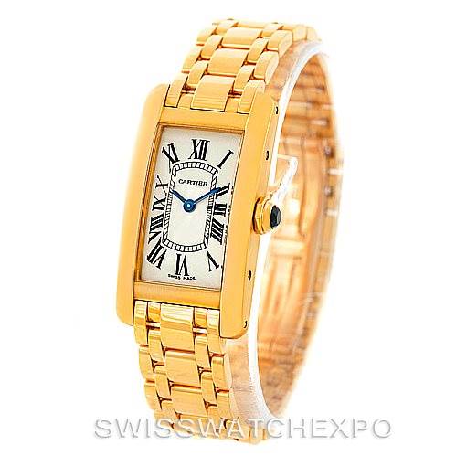 The Cartier Tank Americaine W26015K2 Women's Yellow Gold Silver Dial W26015K2 Women's Yellow Gold Silver Dial watch is shown from a front angle, displaying its face and part of the gold bracelet.