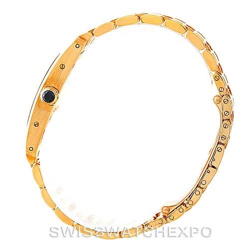 The image shows a side view of the Cartier Tank Américaine watch, highlighting its bracelet and crown.