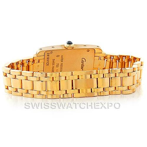 This image shows the back of a Cartier Tank Americaine W26015K2 Women's Yellow Gold Silver Dial W26015K2 Women's Yellow Gold Silver Dial watch, highlighting its gold bracelet and case.