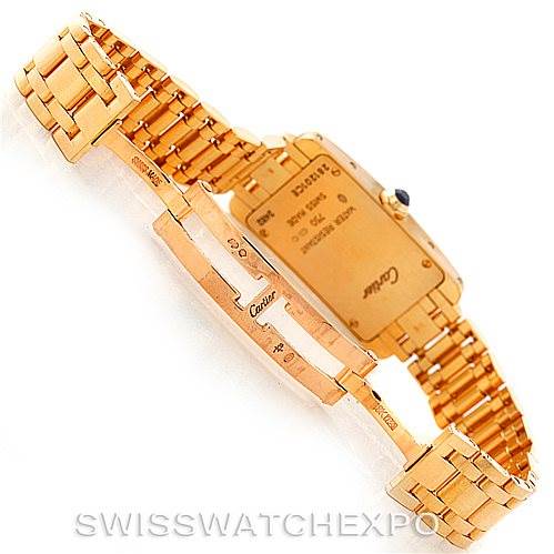 This image shows the back and clasp of the Cartier Tank Americaine W26015K2 Women's Yellow Gold Silver Dial W26015K2 Women's Yellow Gold Silver Dial watch at an angled view.