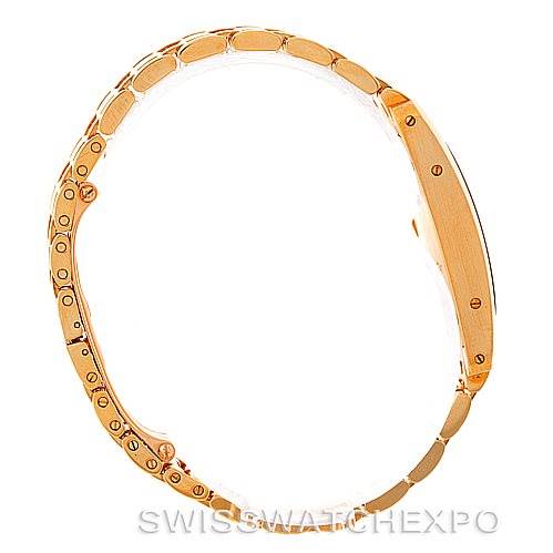 This image shows a side profile of the Cartier Tank Americaine W26015K2 Women's Yellow Gold Silver Dial W26015K2 Women's Yellow Gold Silver Dial watch, highlighting its gold bracelet and slim case.