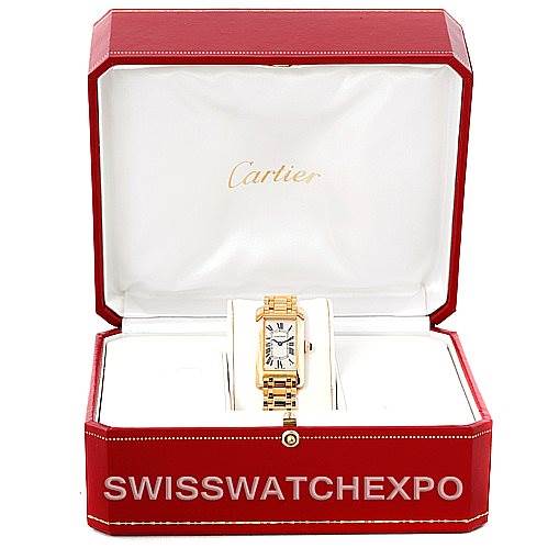 The image shows a Cartier Tank Américaine watch from a front angle, displayed in an open red Cartier box.