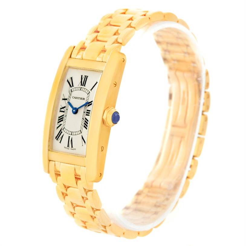 The image shows a gold Cartier Tank Americaine W26015K2 Women
s Yellow Gold Silver Dial W26015K2 Women
s Yellow Gold Silver Dial watch at a slight angle, highlighting the face, bracelet, and crown.
