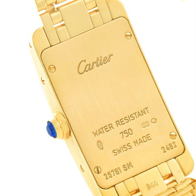 This image shows the back case of the Cartier Tank Americaine W26015K2 Women
s Yellow Gold Silver Dial W26015K2 Women
s Yellow Gold Silver Dial watch, highlighting its water resistance and Swiss origin.