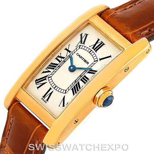 The image shows a Cartier Tank Américaine watch at an angled close-up, highlighting the dial, case, crown, and leather strap.
