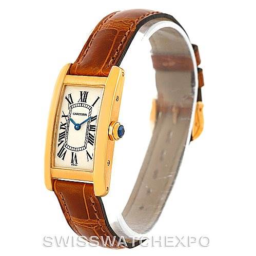 The image shows a Cartier Tank Americaine W2601956 Women's Yellow Gold Silver Dial W2601956 Women's Yellow Gold Silver Dial watch, displaying the face, bezel, crown, and leather strap at a side angle.