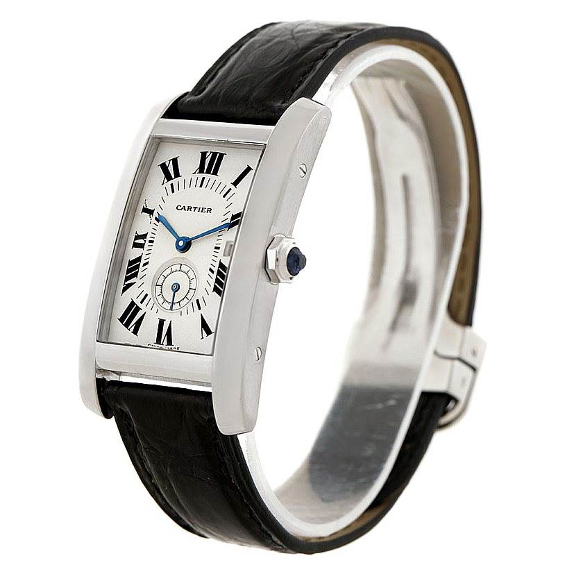 This Cartier Tank Americaine Women
s White Gold Silver Dial Women
s White Gold Silver Dial watch is shown at a three-quarter angle, displaying its face, crown, and leather strap.