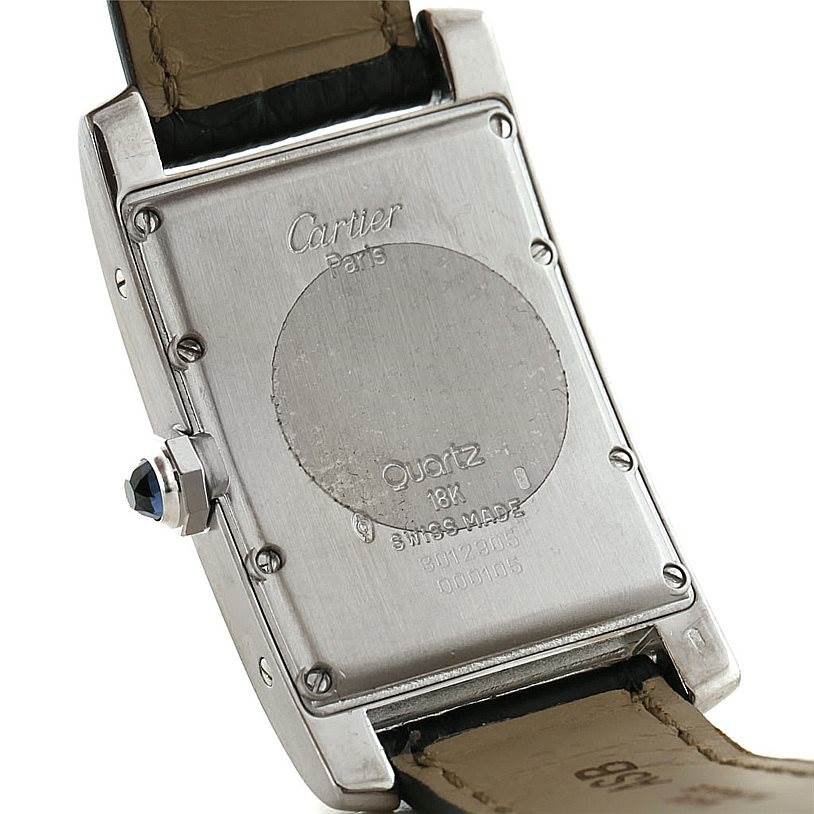 This image shows the back of a Tank Américaine model by Cartier with details of the case and strap attachment.
