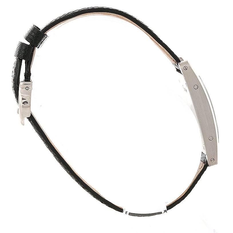 The image shows a side view of a Tank Americaine model by Cartier, focusing on the slim profile and leather strap.