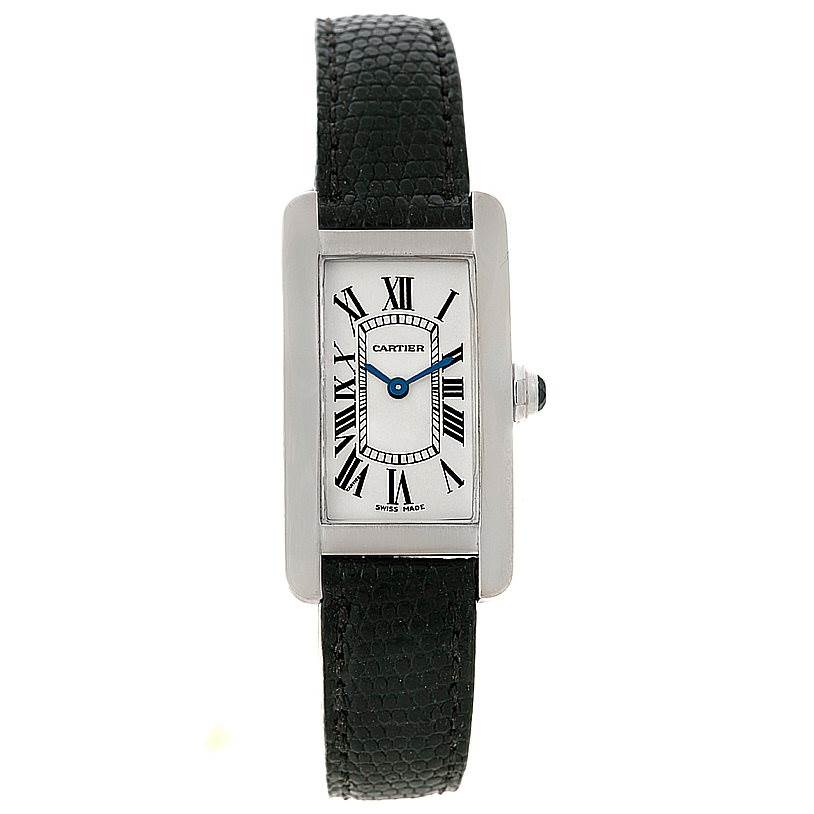 The image shows a front view of a Cartier Tank Americaine W2601956 Women
s White Gold Silver Dial W2601956 Women
s White Gold Silver Dial model watch with a black leather strap and rectangular face.
