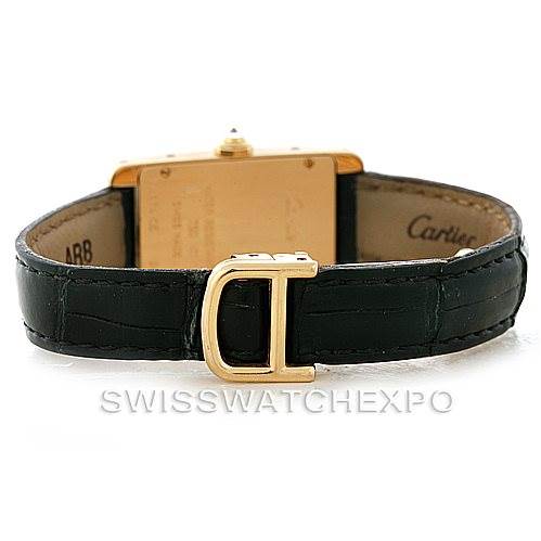 The image shows the back of the Cartier Tank Americaine W2601956 Women's Yellow Gold Silver Dial W2601956 Women's Yellow Gold Silver Dial watch, focusing on the clasp and leather strap.