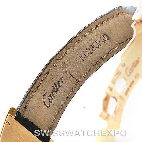 This image shows the strap and part of the buckle of a Cartier Tank Americaine W2601956 Women's Yellow Gold Silver Dial W2601956 Women's Yellow Gold Silver Dial model watch, viewed from the side.