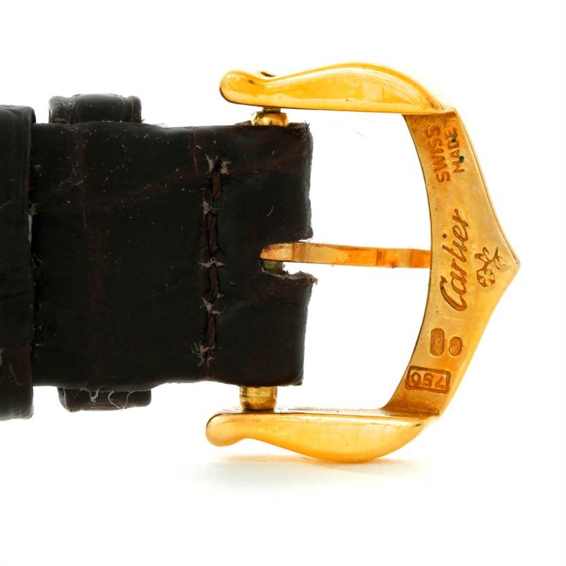 The image shows a close-up of the clasp and part of the leather strap of a Cartier Tank Americaine W2601956 Women's Yellow Gold Silver Dial W2601956 Women's Yellow Gold Silver Dial watch.