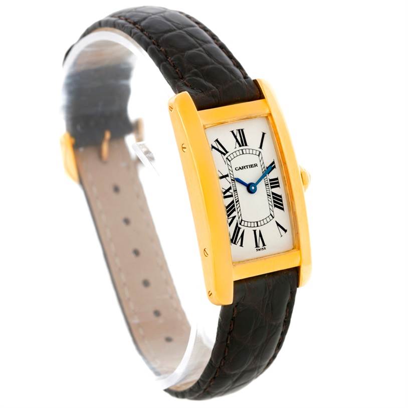 The image shows a Cartier Tank Americaine W2601956 Women's Yellow Gold Silver Dial W2601956 Women's Yellow Gold Silver Dial watch at a slight diagonal angle, featuring its rectangular face and black leather strap.