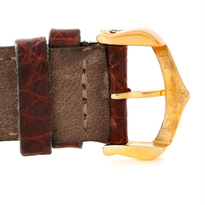 The image shows a close-up of the buckle and part of the leather strap of a Cartier Tank Americaine Women's Yellow Gold Silver Dial Women's Yellow Gold Silver Dial watch.