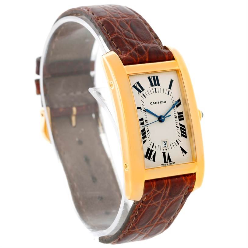The image shows a Cartier Tank Americaine Women's Yellow Gold Silver Dial Women's Yellow Gold Silver Dial watch at a slight angle, highlighting the face, leather strap, and gold case.