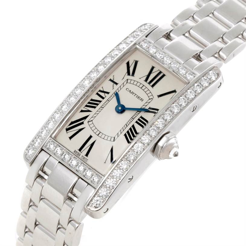 The Cartier Tank Americaine WB707331 Women
s White Gold Silver Dial WB707331 Women
s White Gold Silver Dial watch is shown at an angled view, displaying its face, case, bezel, crown, and part of the bracelet.