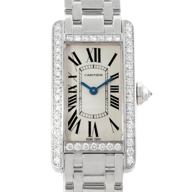 The image shows a front view of a Cartier Tank Americaine WB707331 Women
s White Gold Silver Dial WB707331 Women
s White Gold Silver Dial model watch, including its face, bezel, and partial bracelet.