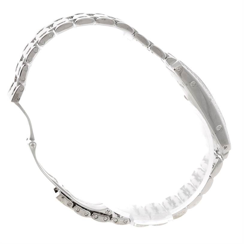 The image shows a side angle of the Cartier Tank Americaine WB707331 Women
s White Gold Silver Dial WB707331 Women
s White Gold Silver Dial model, focusing on its stainless steel bracelet and case.