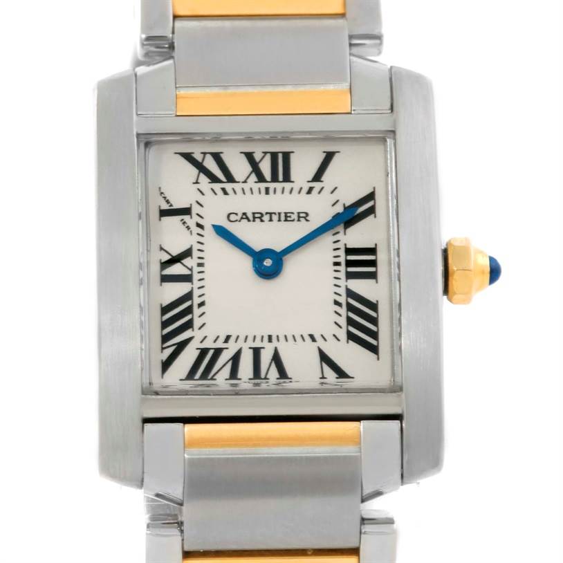 This image shows a close-up of the Cartier Tank Francaise W51007Q4 Women's Steel and Gold (two tone) Silver Dial W51007Q4 Women's Steel and Gold (two tone) Silver Dial watch face and partial bracelet, featuring its iconic Roman numerals and blue hands.