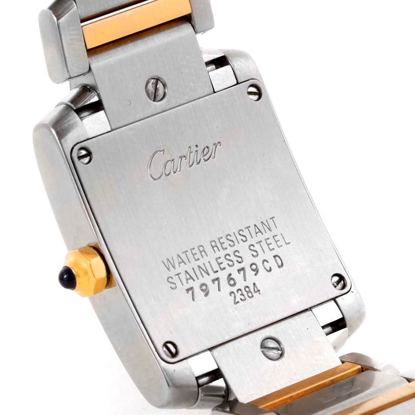 The image shows the back case and part of the bracelet of the Cartier Tank Francaise W51007Q4 Women's Steel and Gold (two tone) Silver Dial W51007Q4 Women's Steel and Gold (two tone) Silver Dial watch at an angled view.