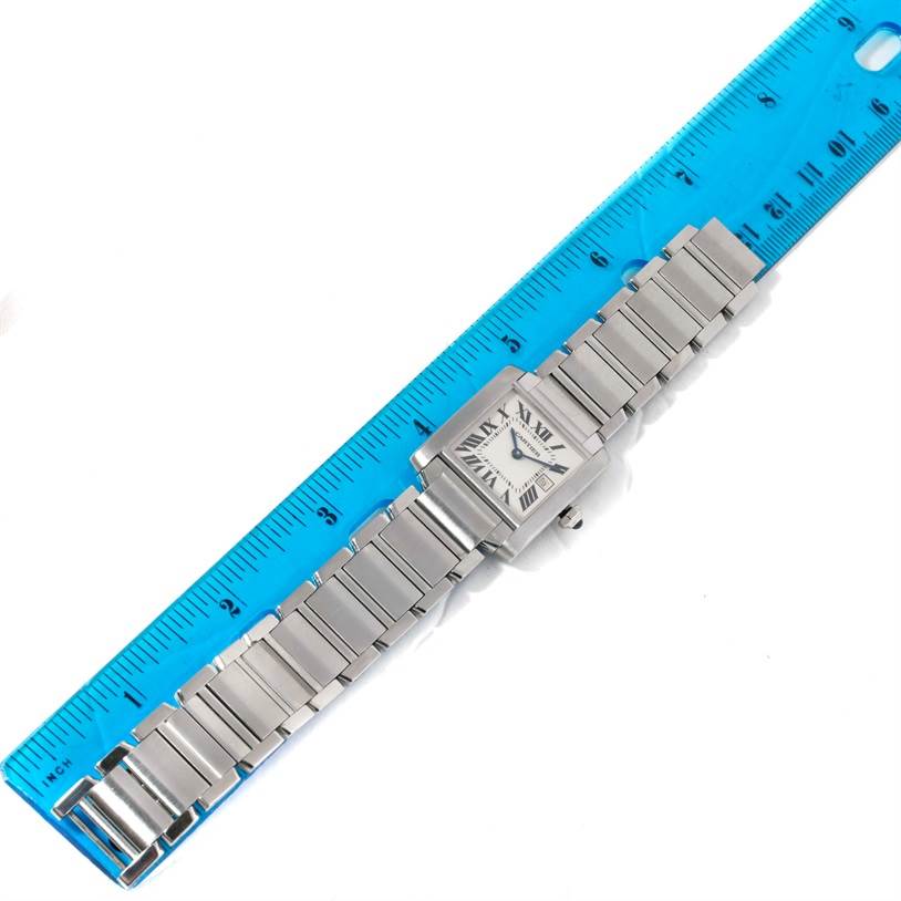 The Cartier Tank Francaise W51011Q3 Women's Stainless Steel Silver Dial W51011Q3 Women's Stainless Steel Silver Dial watch is shown from a top-down angle, displaying the face and metal bracelet against a ruler for size reference.