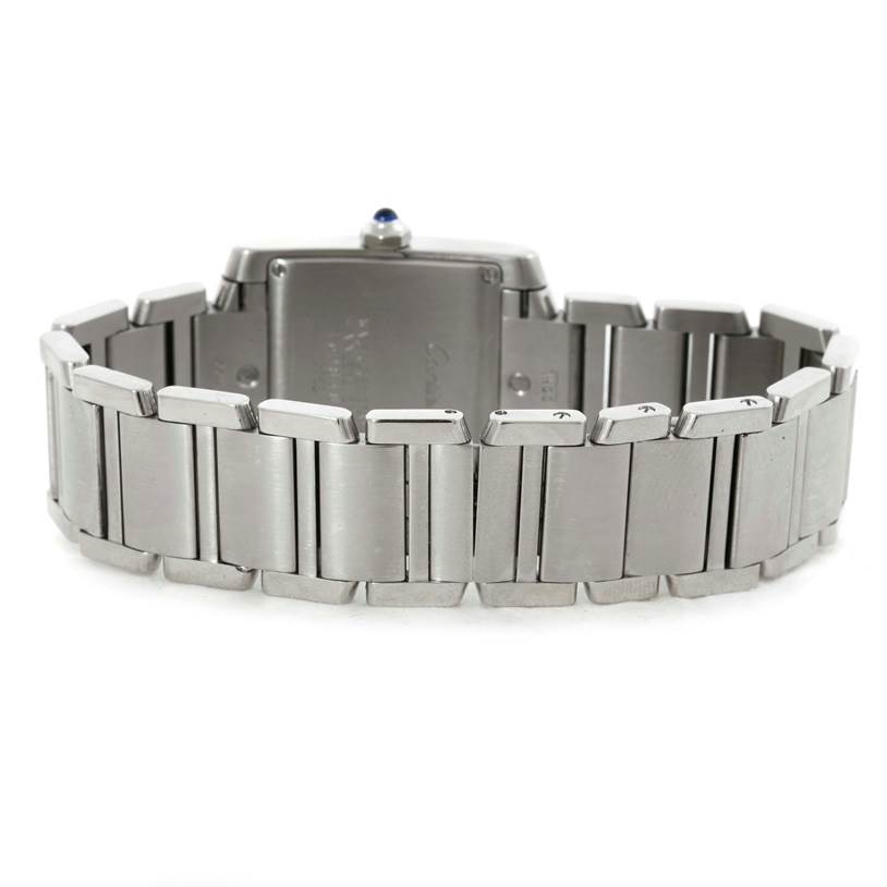 The image shows the back case and bracelet of a Cartier Tank Française watch.