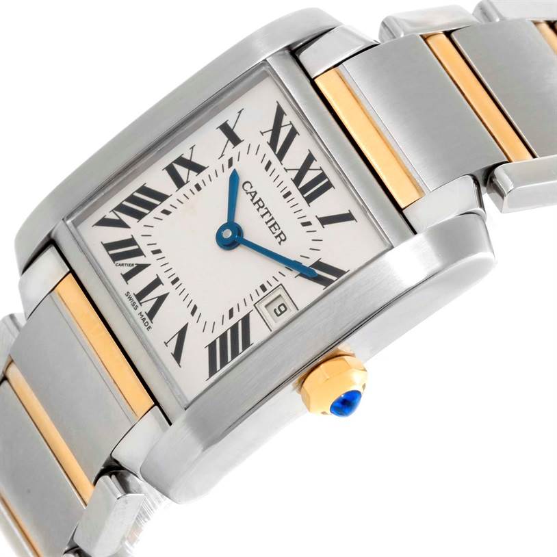 This image shows a close-up of the dial, crown, and a portion of the bracelet of the Cartier Tank Française watch.
