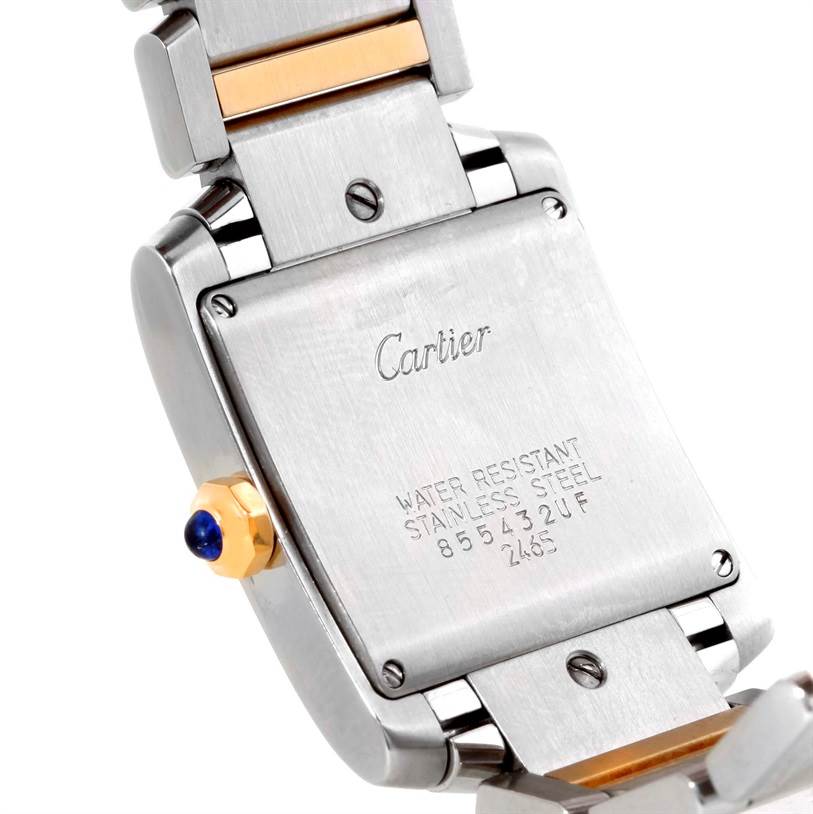 The image shows the back case and part of the bracelet of a Cartier Tank Française watch.