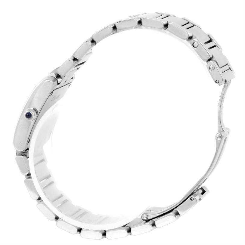 The image shows a side view of a Cartier Tank Française watch, detailing its link bracelet and crown with a blue cabochon.