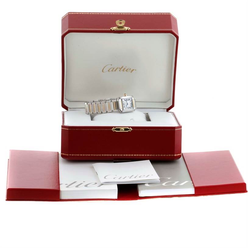 The Cartier Tank Francaise W51007Q4 Women's Steel and Gold (two tone) Silver Dial W51007Q4 Women's Steel and Gold (two tone) Silver Dial watch is displayed in an open red box, showing the face and bracelet, with booklets in front.