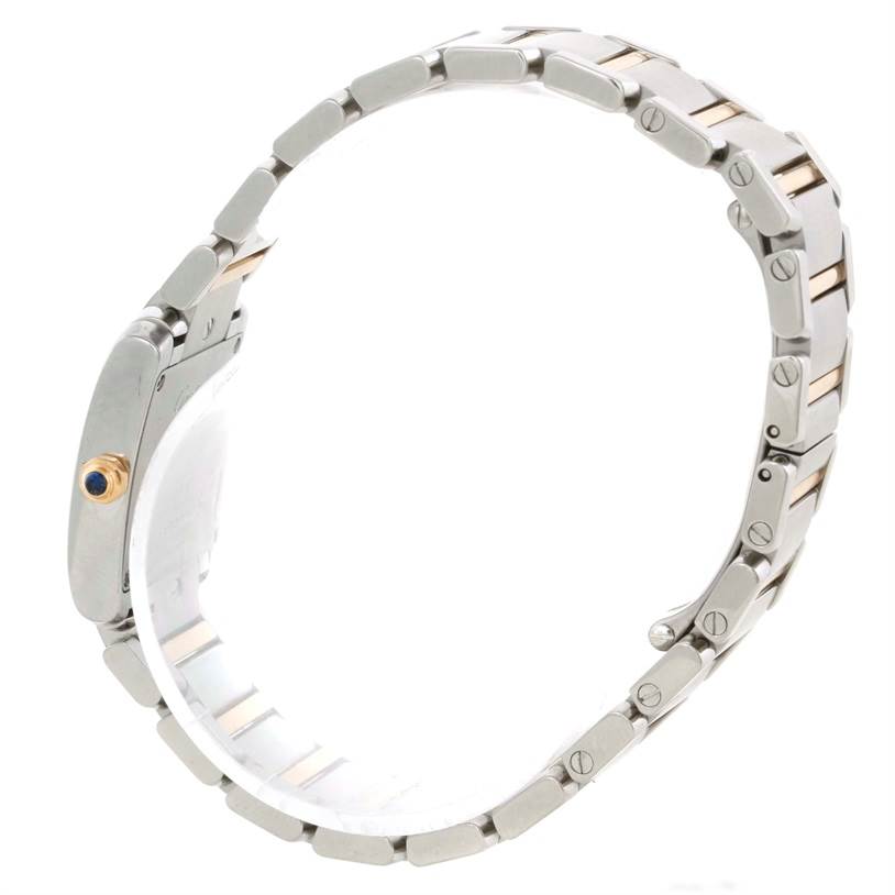 The image shows a side view of the Cartier Tank Francaise W51007Q4 Women's Steel and Gold (two tone) Silver Dial W51007Q4 Women's Steel and Gold (two tone) Silver Dial watch, highlighting the bracelet and crown with blue cabochon.